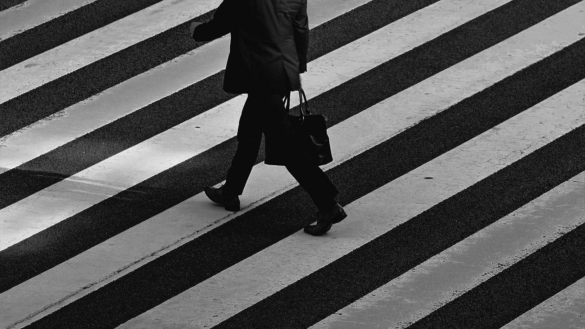 Person in a structured blazer, face in shadow, conveying authority and outfit-driven confidence